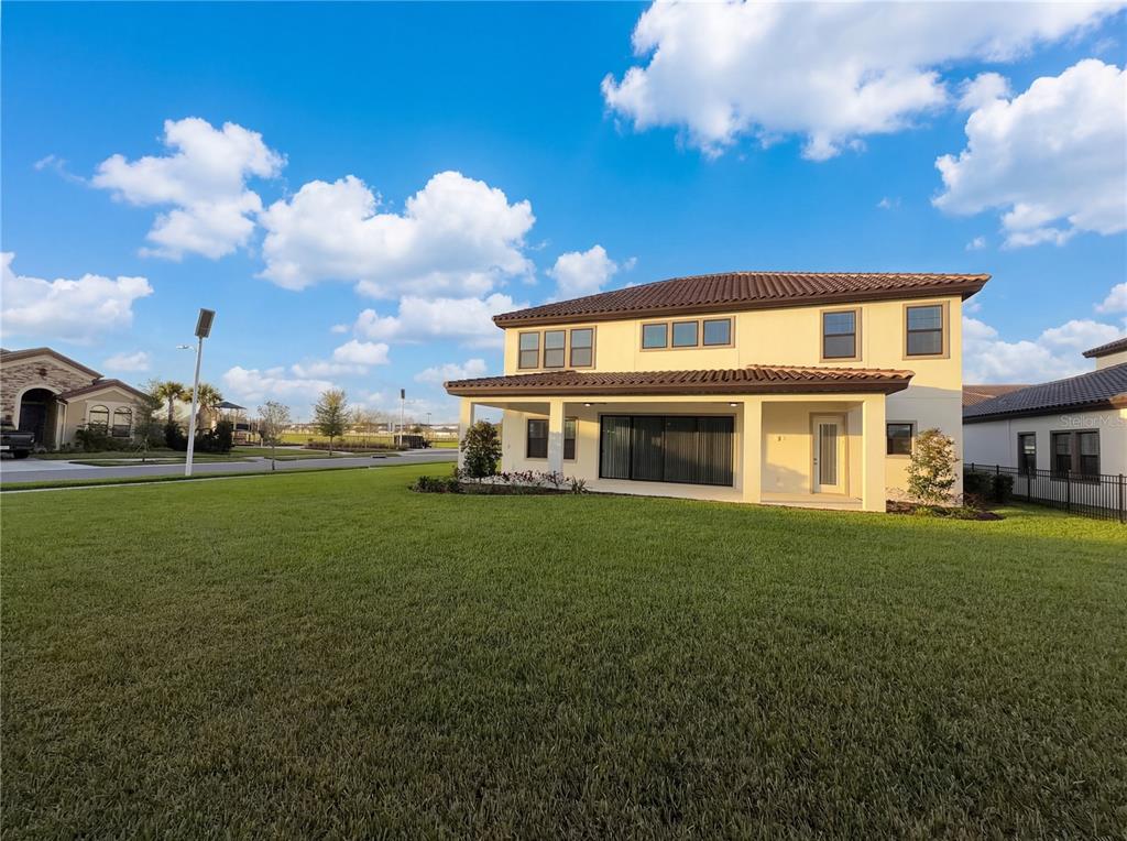 11277 Rustic Timber Loop San Antonio, FL 33576 - Photo 22 of 55 a front view of a house with garden