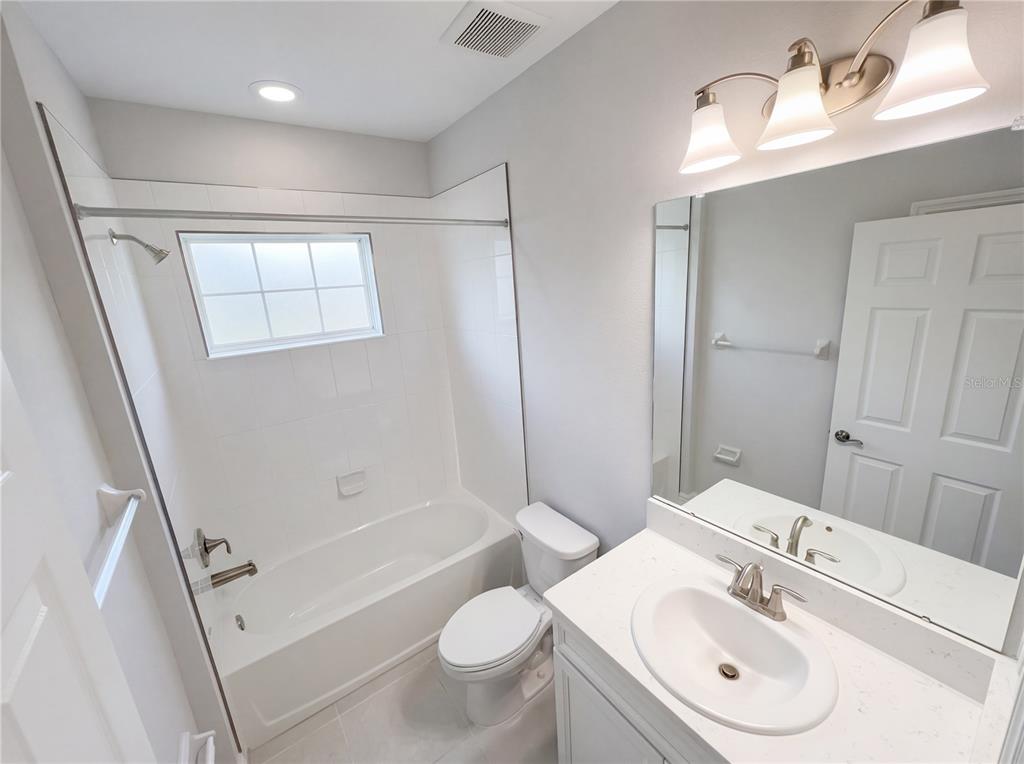 11277 Rustic Timber Loop San Antonio, FL 33576 - Photo 25 of 55 a bathroom with a sink toilet and shower