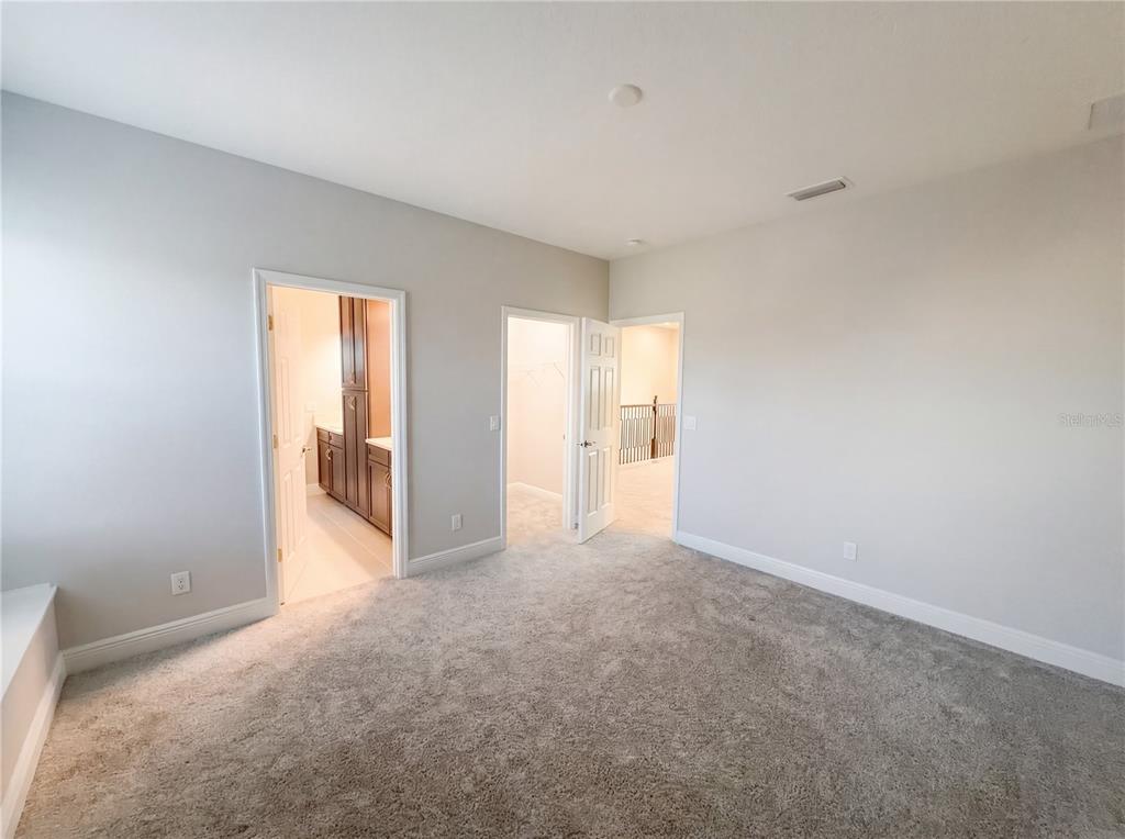11277 Rustic Timber Loop San Antonio, FL 33576 - Photo 31 of 55 a view of an empty room and a window
