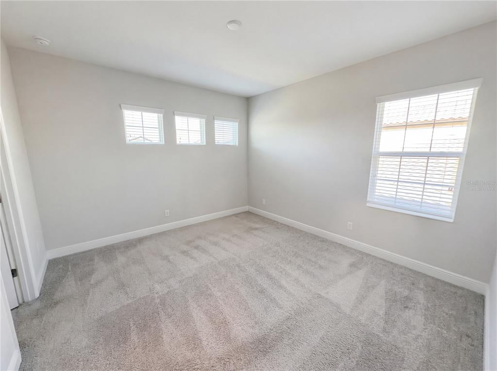 11277 Rustic Timber Loop San Antonio, FL 33576 - Photo 4 of 55 an empty room with windows
