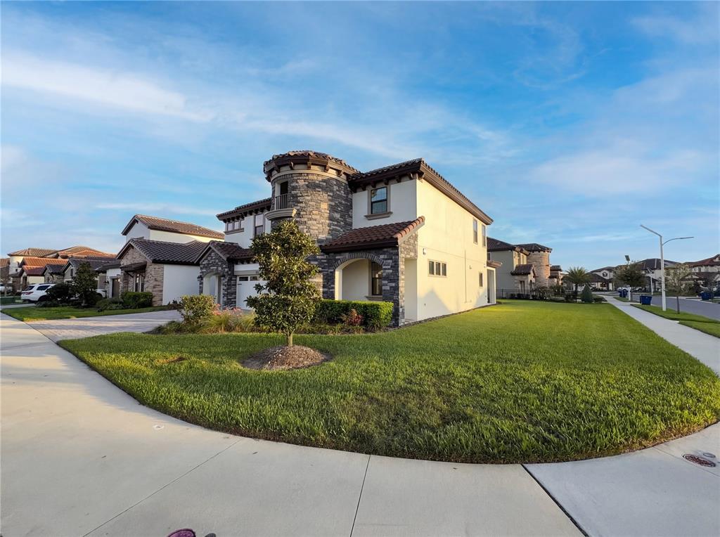 11277 Rustic Timber Loop San Antonio, FL 33576 - Photo 41 of 55 a front view of a house with garden