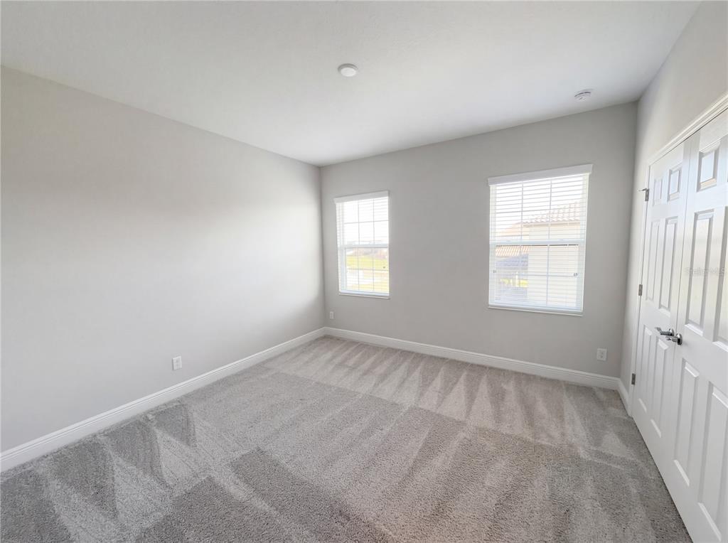 11277 Rustic Timber Loop San Antonio, FL 33576 - Photo 48 of 55 a view of an empty room with a window