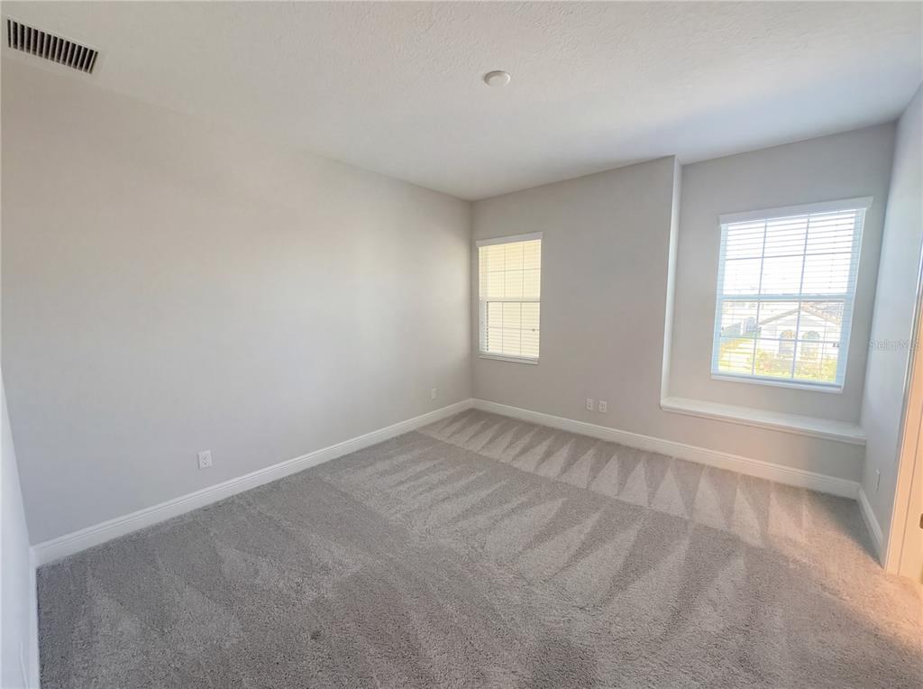 11277 Rustic Timber Loop San Antonio, FL 33576 - Photo 50 of 55 an empty room with windows