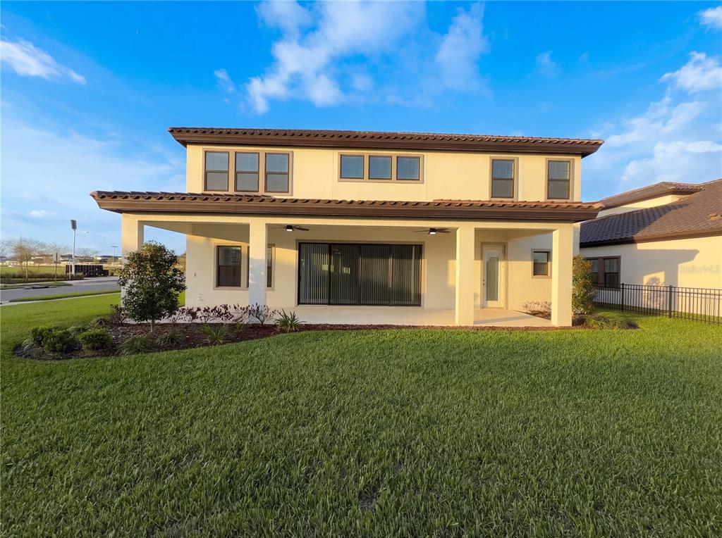 11277 Rustic Timber Loop San Antonio, FL 33576 - Photo 5 of 55 a front view of a house with a garden