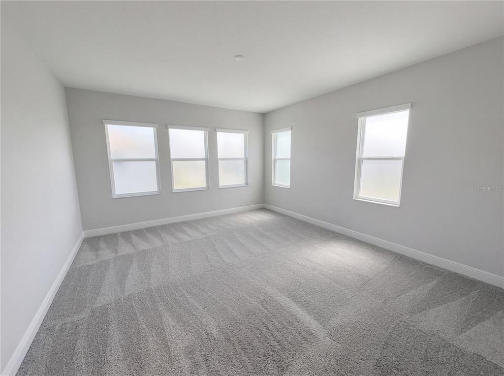 11277 Rustic Timber Loop San Antonio, FL 33576 - Photo 54 of 55 an empty room with windows