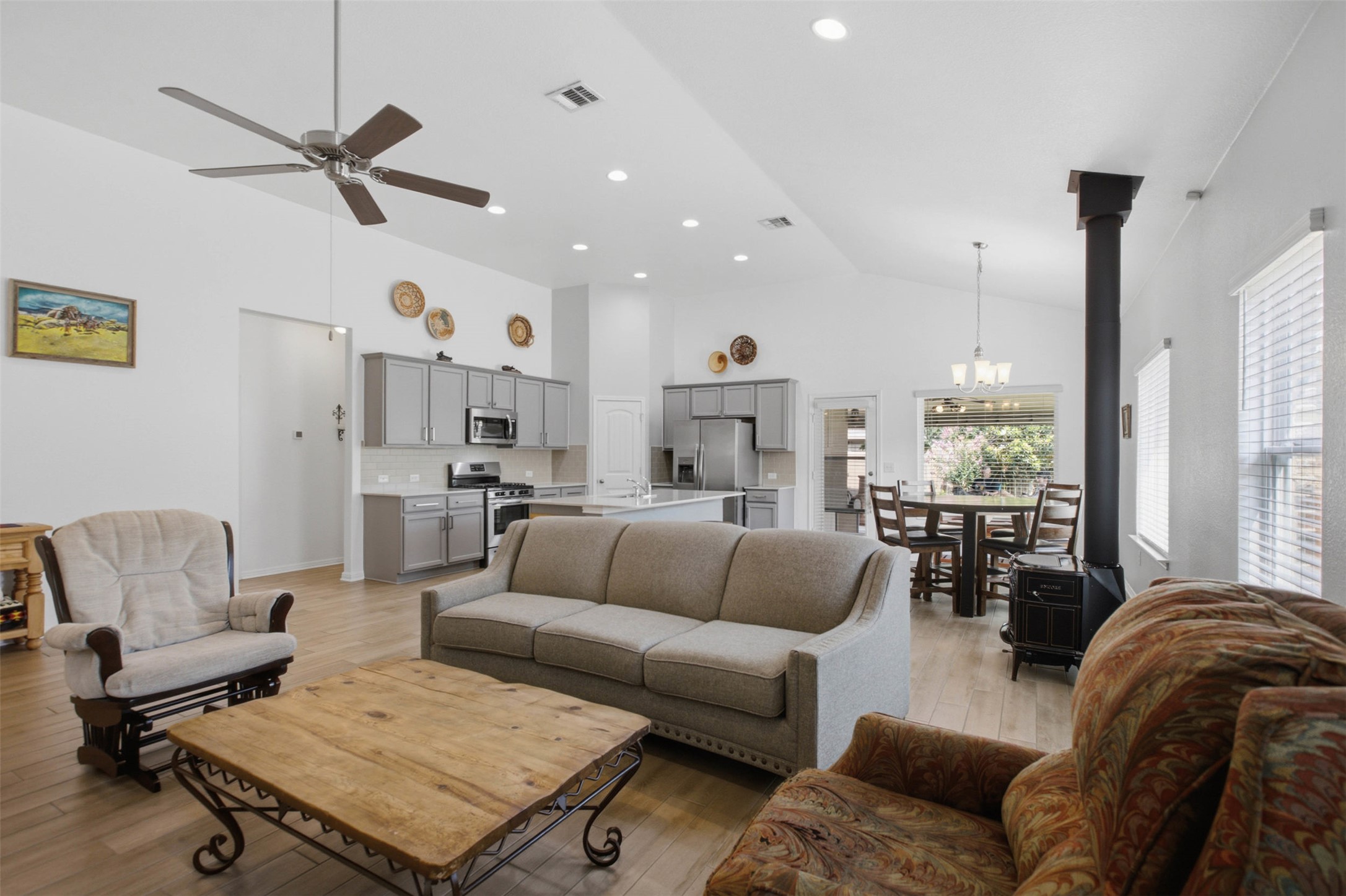 2413 Bridges Ranch Road Georgetown, TX 78628 - Photo 30 of 31 An open floorplan seamlessly connects the well-appointed kitchen to a comfortable living area, creating an inviting space for gatherings.