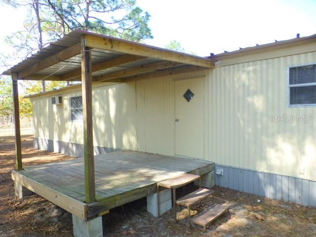 4920 East Hunts Court, Unit 2 Inverness, FL 34452 - Photo 1 of 1 a backyard of a house