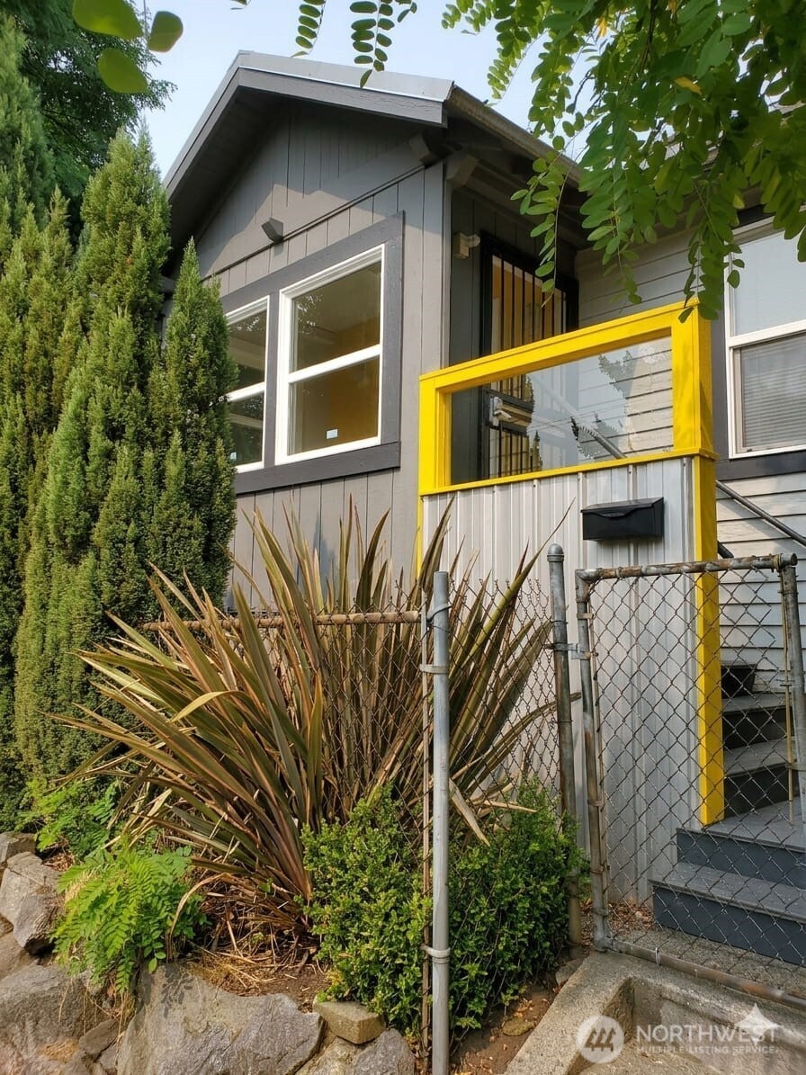 a view of a house with a tree