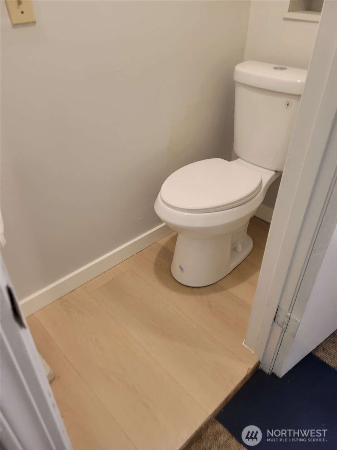 2424 South Graham Street Seattle, WA 98108 - Photo 16 of 23 a white toilet sitting next to a shower