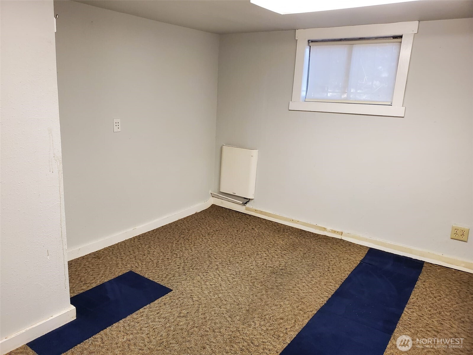 2424 South Graham Street Seattle, WA 98108 - Photo 19 of 23 an empty room with wooden floor and windows