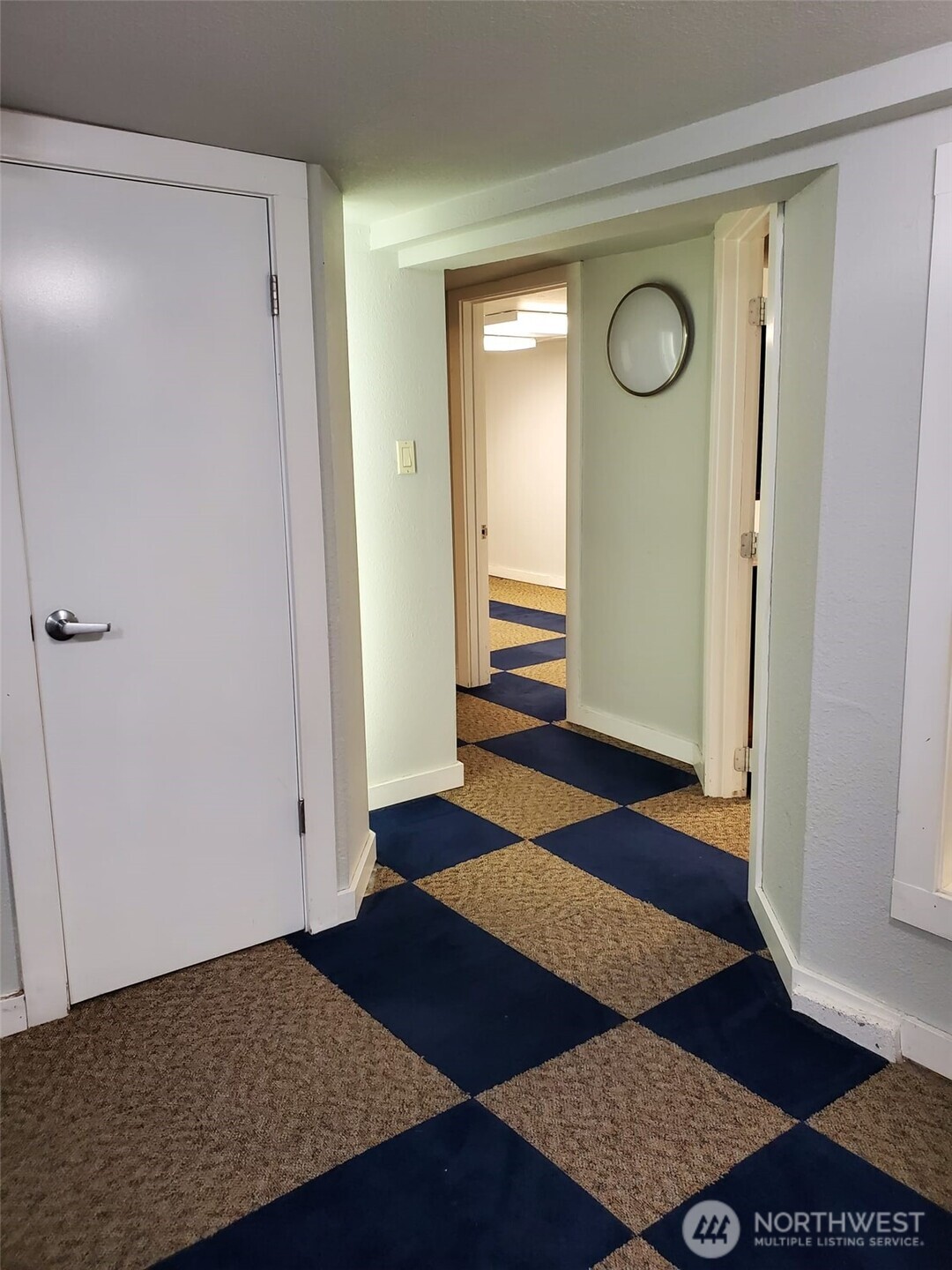 2424 South Graham Street Seattle, WA 98108 - Photo 21 of 23 a view of an empty room with wooden floor and closet