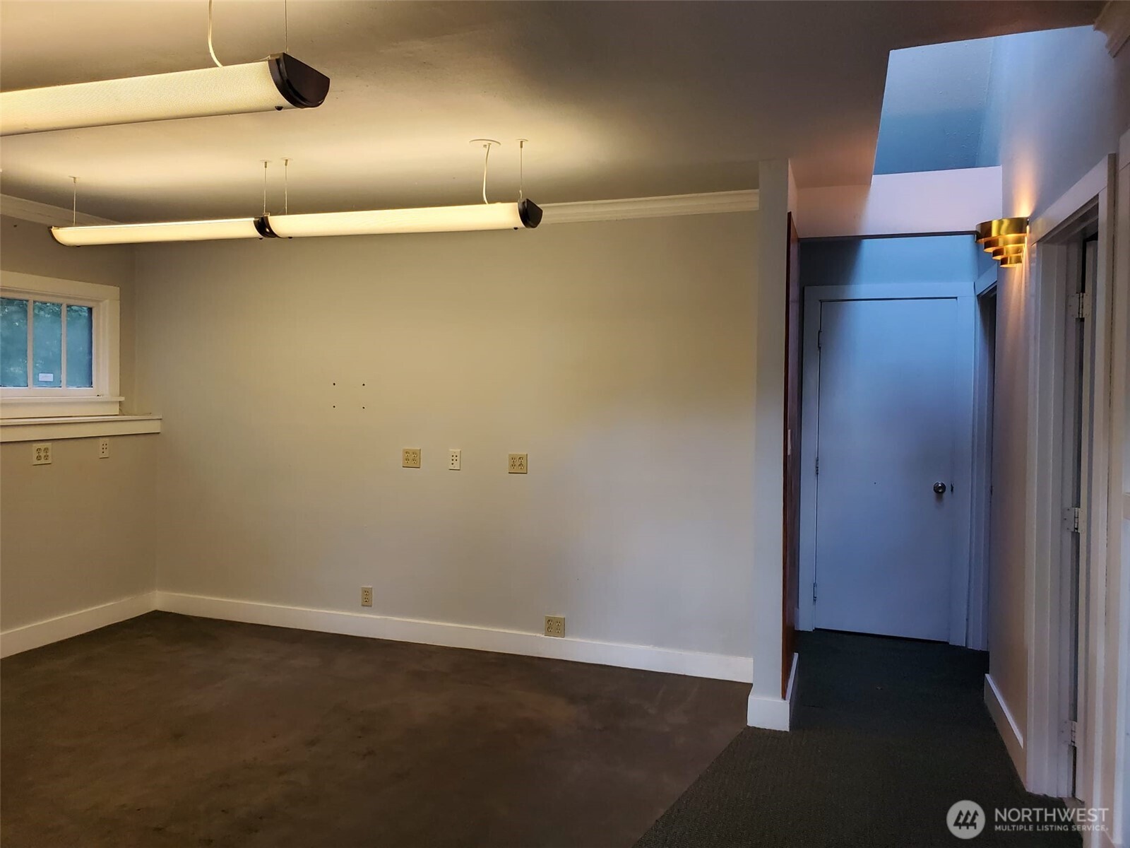 2424 South Graham Street Seattle, WA 98108 - Photo 4 of 23 an empty room with wooden floor