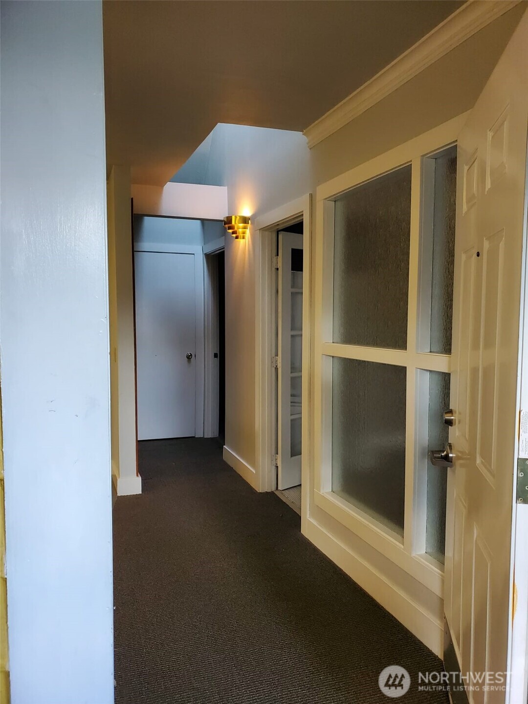 2424 South Graham Street Seattle, WA 98108 - Photo 5 of 23 an empty room with a door
