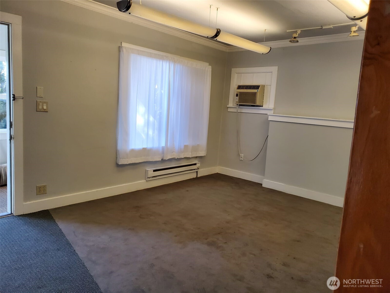2424 South Graham Street Seattle, WA 98108 - Photo 7 of 23 an empty room with windows