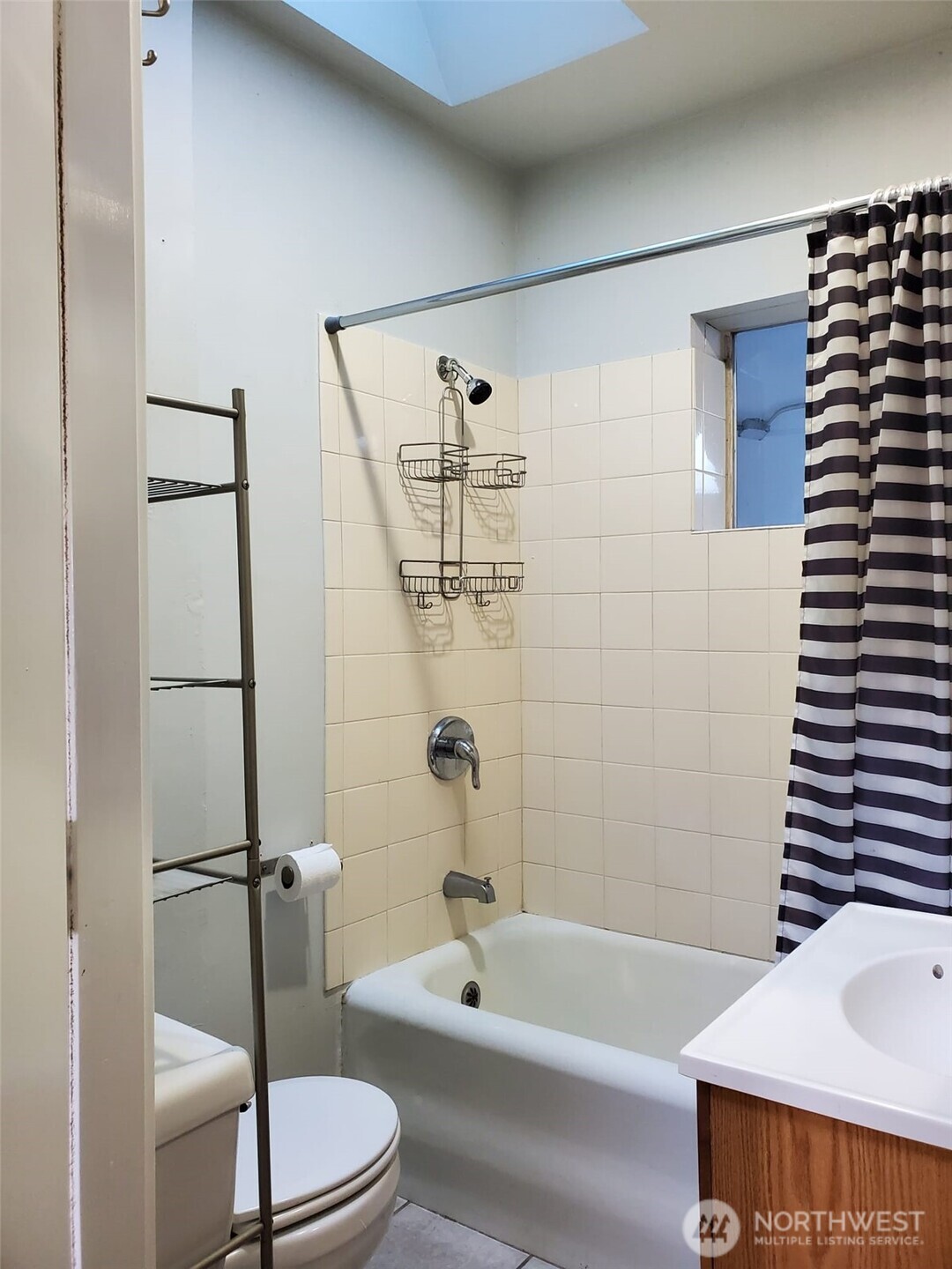 2424 South Graham Street Seattle, WA 98108 - Photo 9 of 23 a bathroom with a bathtub and a shower