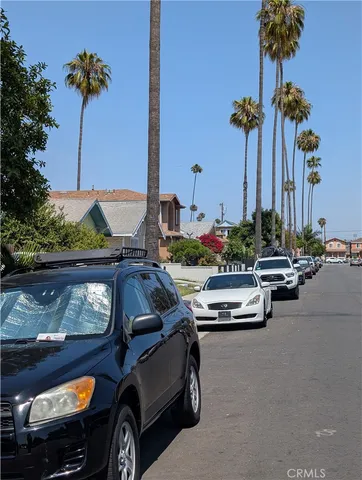 a view of a city street with cars