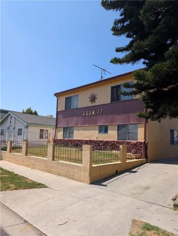 a view of a building with a yard
