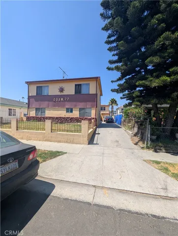 a view of a street with cars
