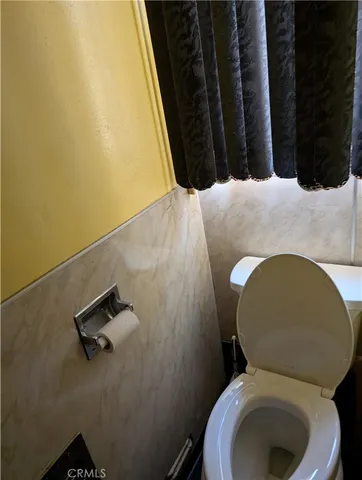 a bathroom with a toilet and a sink
