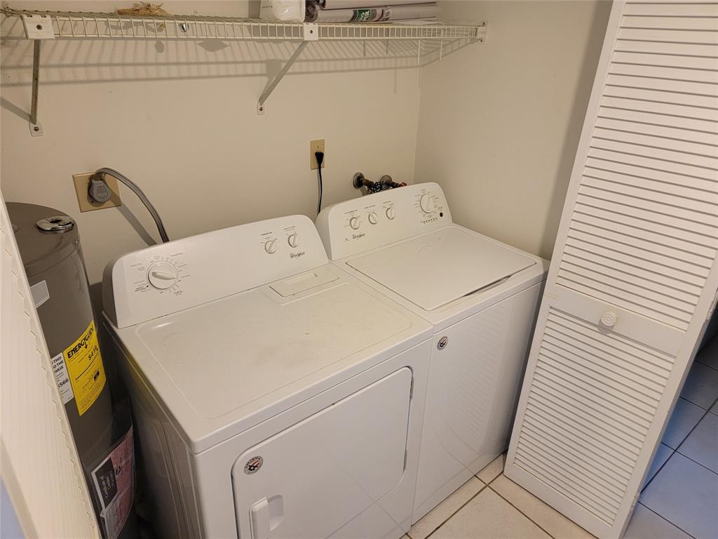 1800 Northeast 39th Court, Unit 1001 Pompano Beach, FL 33064 - Photo 16 of 39 a utility room with dryer and washer