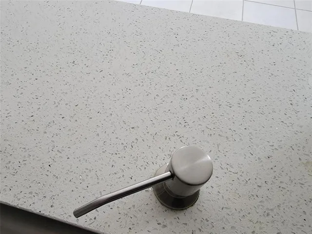 a kitchen with white cabinets