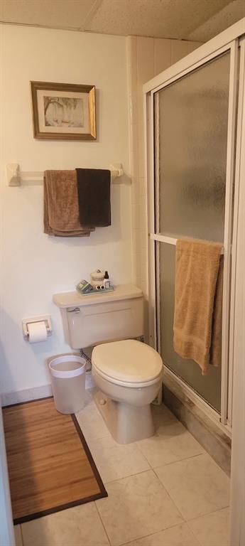 1800 Northeast 39th Court, Unit 1001 Pompano Beach, FL 33064 - Photo 26 of 39 a bathroom with a toilet and a shower