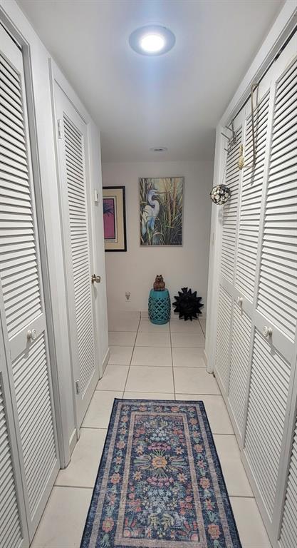 1800 Northeast 39th Court, Unit 1001 Pompano Beach, FL 33064 - Photo 34 of 39 a view of a hallway with a couch