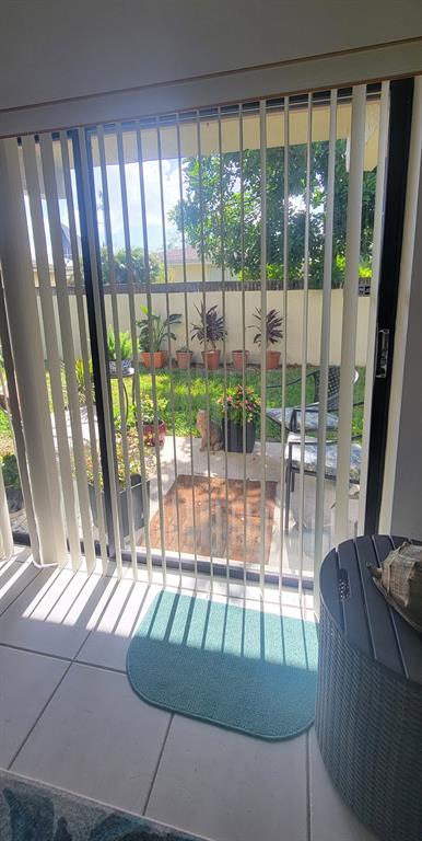 1800 Northeast 39th Court, Unit 1001 Pompano Beach, FL 33064 - Photo 38 of 39 a view of porch with a furniture