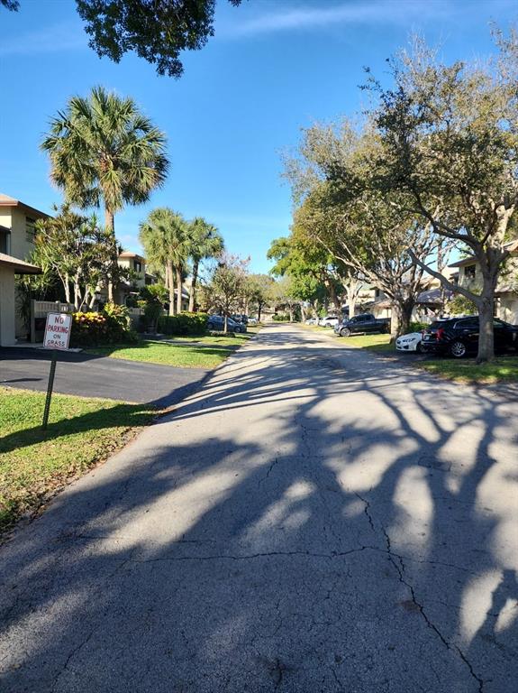 1800 Northeast 39th Court, Unit 1001 Pompano Beach, FL 33064 - Photo 4 of 39 a view of a house with a street