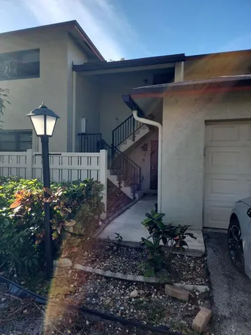 a house view with a garden space
