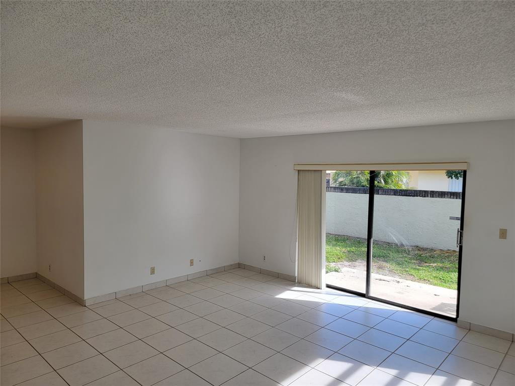 1800 Northeast 39th Court, Unit 1001 Pompano Beach, FL 33064 - Photo 10 of 39 a view of an empty room with a window