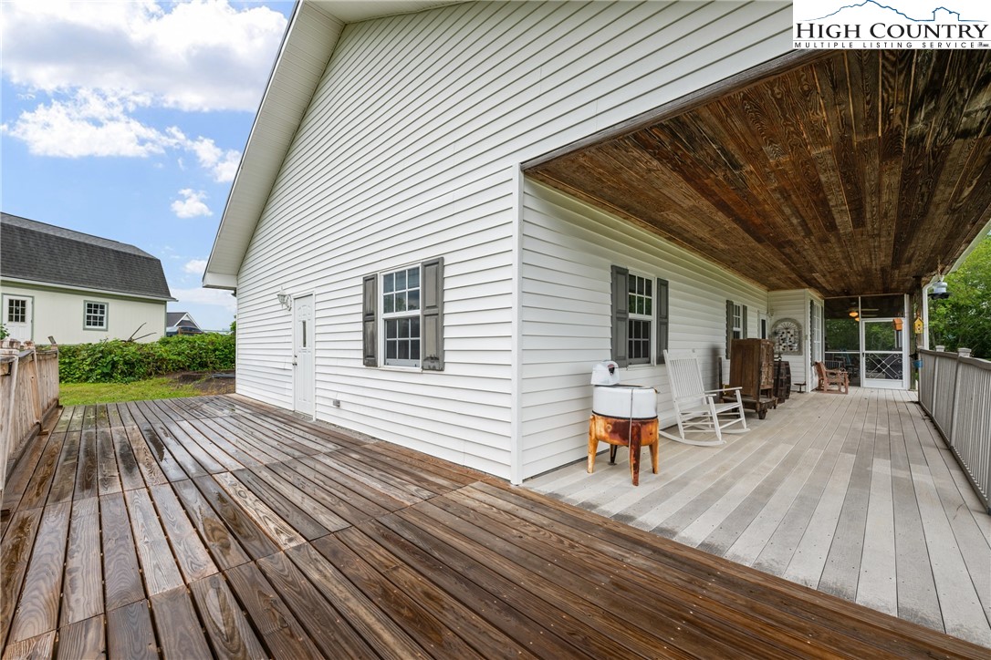 175 Olive Ridge Drive Crumpler, NC 28617 - Photo 46 of 50 a view of a deck with wooden floor and seating space