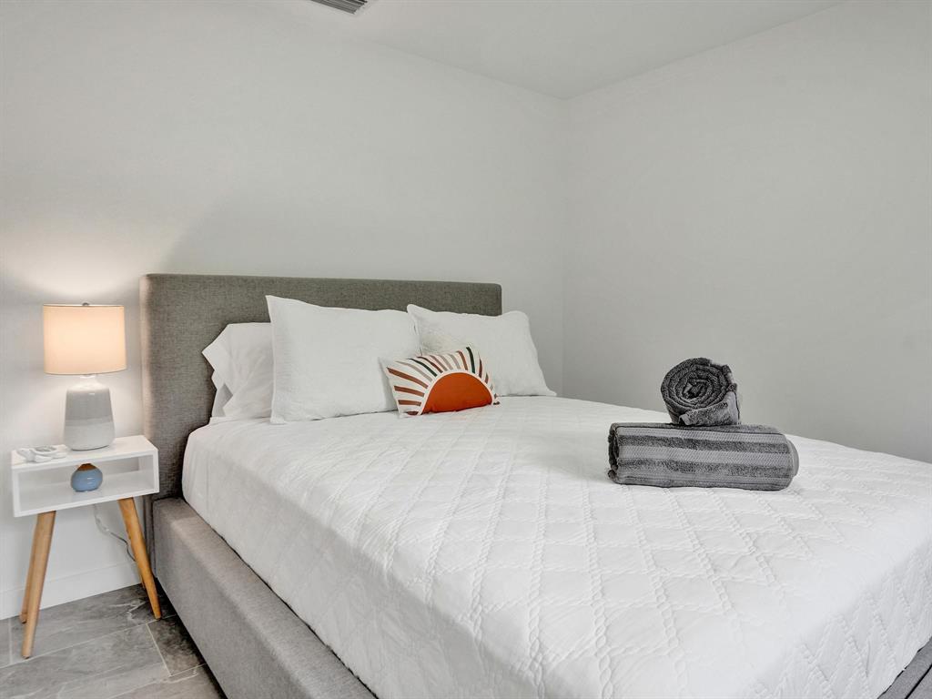 260 Northwest 36th Street Boca Raton, FL 33431 - Photo 15 of 35 a bedroom with a bed and window