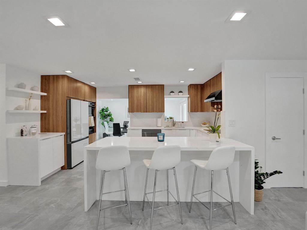 260 Northwest 36th Street Boca Raton, FL 33431 - Photo 2 of 35 a kitchen with appliances a sink and a refrigerator