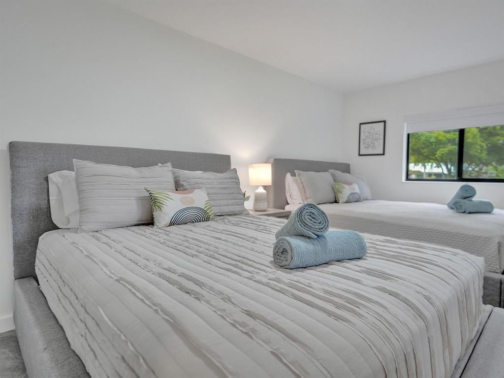 260 Northwest 36th Street Boca Raton, FL 33431 - Photo 23 of 35 a bedroom with a bed and window