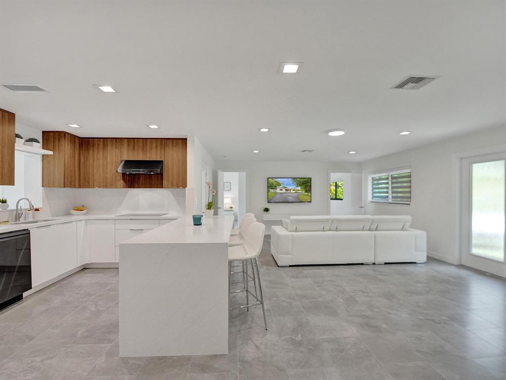 260 Northwest 36th Street Boca Raton, FL 33431 - Photo 30 of 35 a living room with kitchen island furniture and kitchen view