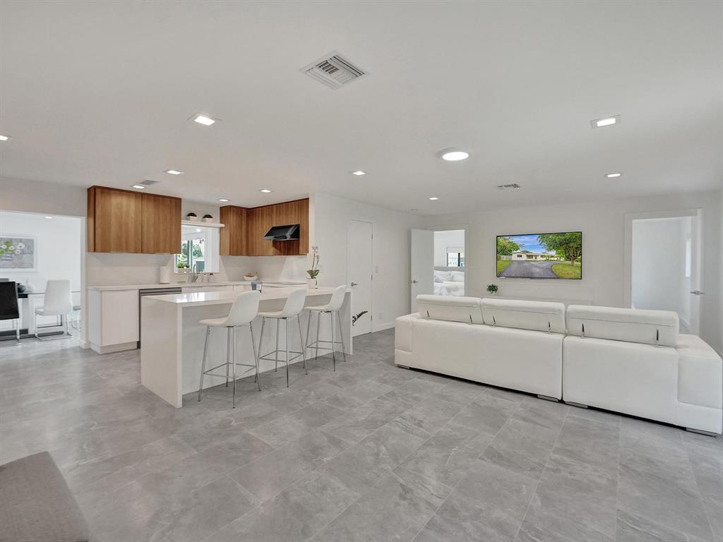 260 Northwest 36th Street Boca Raton, FL 33431 - Photo 3 of 35 a living room with furniture and a flat screen tv