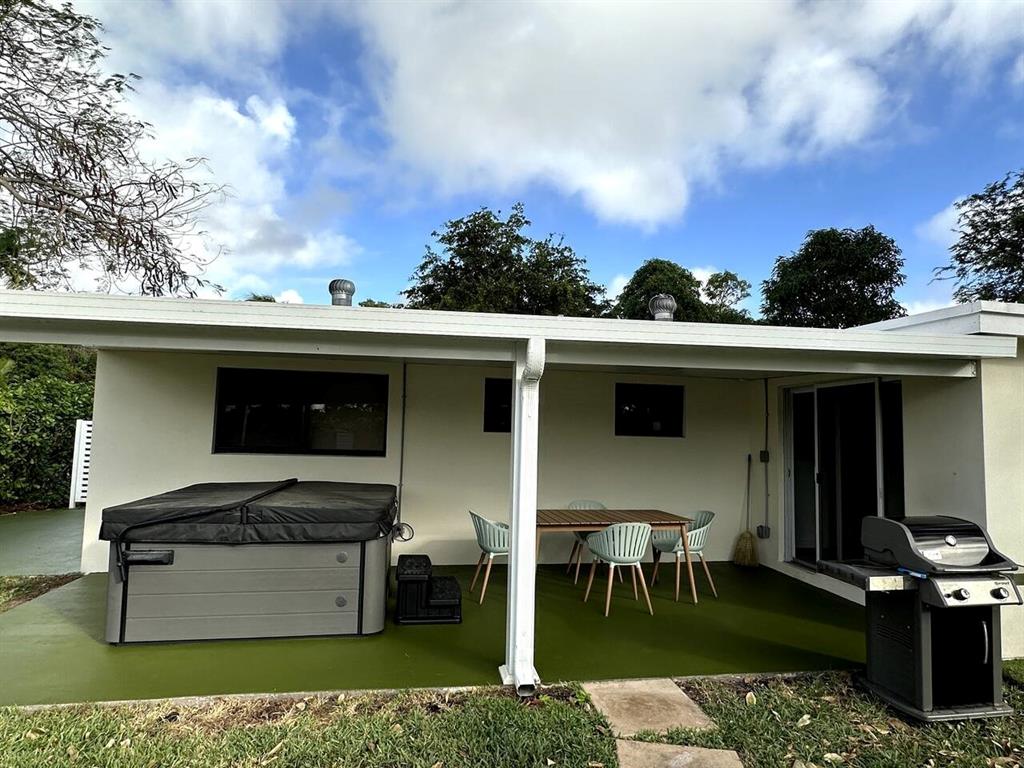 260 Northwest 36th Street Boca Raton, FL 33431 - Photo 34 of 35 a front view of a house with a yard