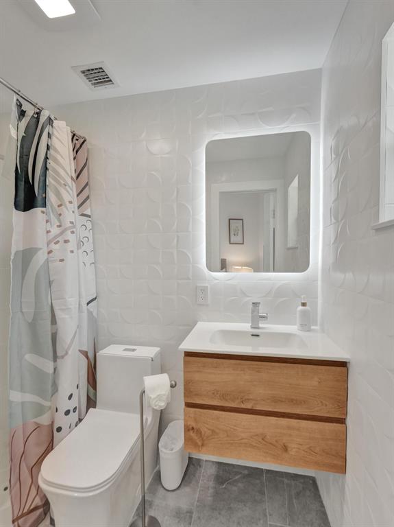 260 Northwest 36th Street Boca Raton, FL 33431 - Photo 6 of 35 a bathroom with a sink toilet and shower