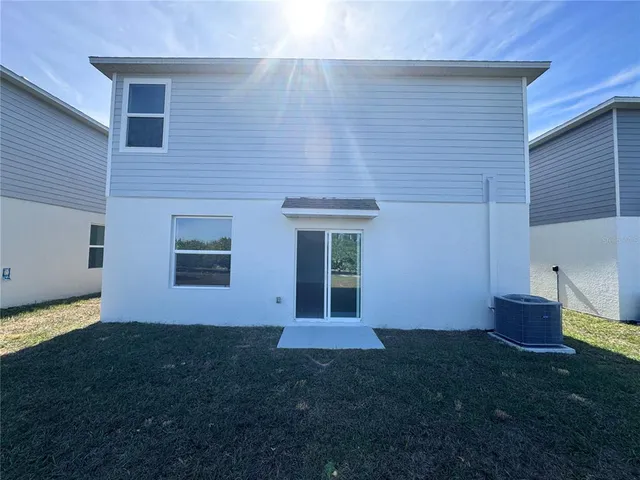 a house view with a backyard space
