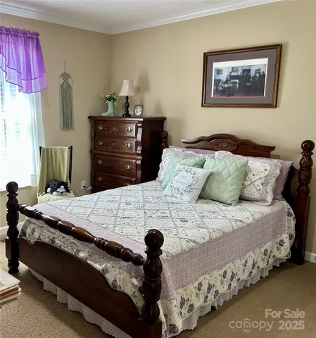 a bedroom with bed and a dresser