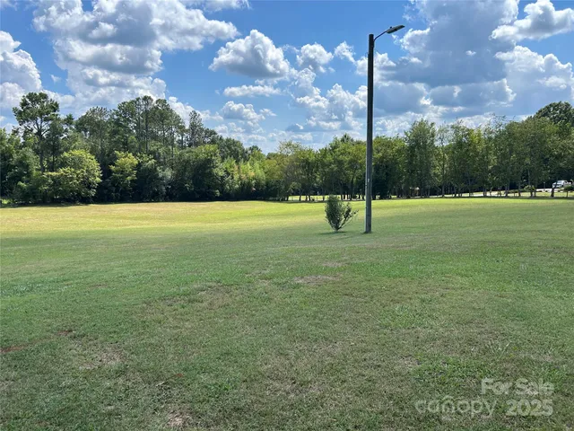 a view of an outdoor space and basketball court