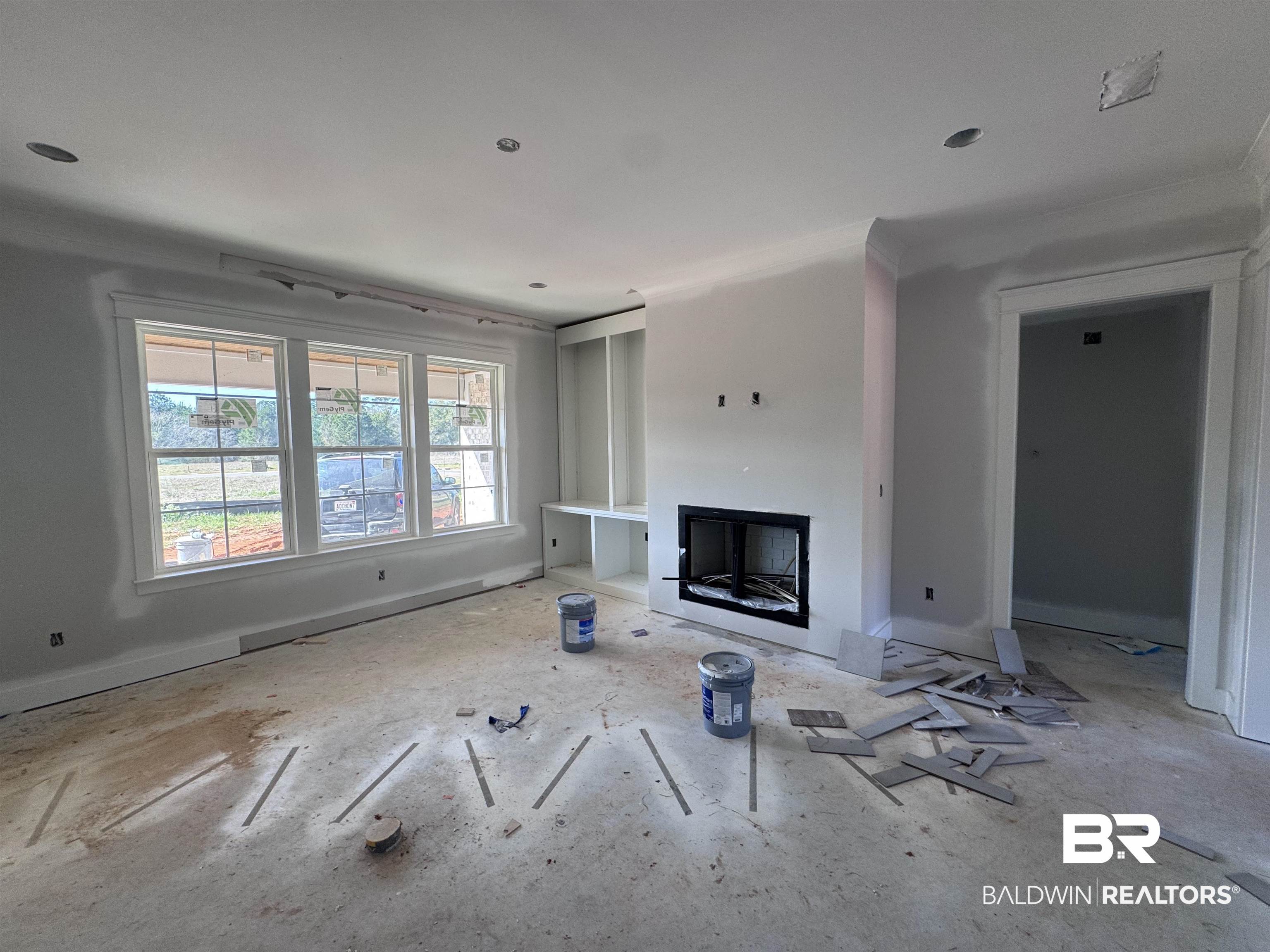 27371 Patch Pl Loop Daphne, AL 36526 - Photo 7 of 63 Unfurnished living room featuring a fireplace and baseboards