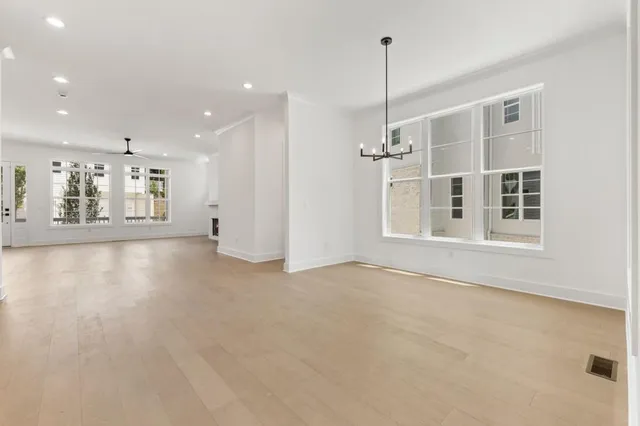 a kitchen with stainless steel appliances granite countertop a sink a stove and a refrigerator