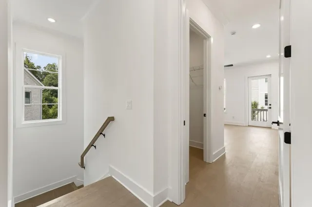 a white bath tub sitting next to a shower