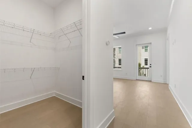 an empty room with a empty space and windows