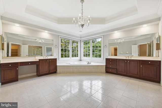 a large spacious bathroom with a large tub and sink