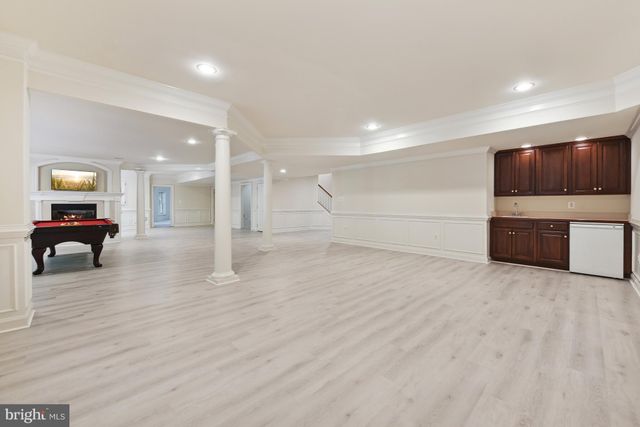 a view of room with furniture and kitchen view