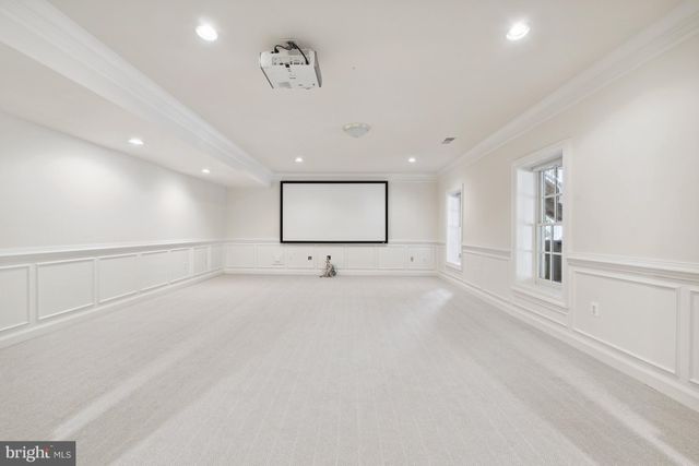 an empty room with a empty space and windows