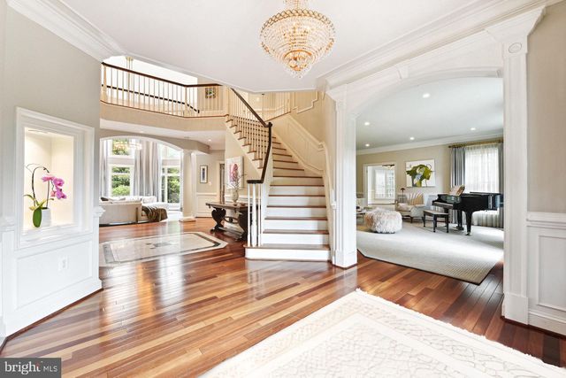 a living room with fireplace furniture and a wooden floor